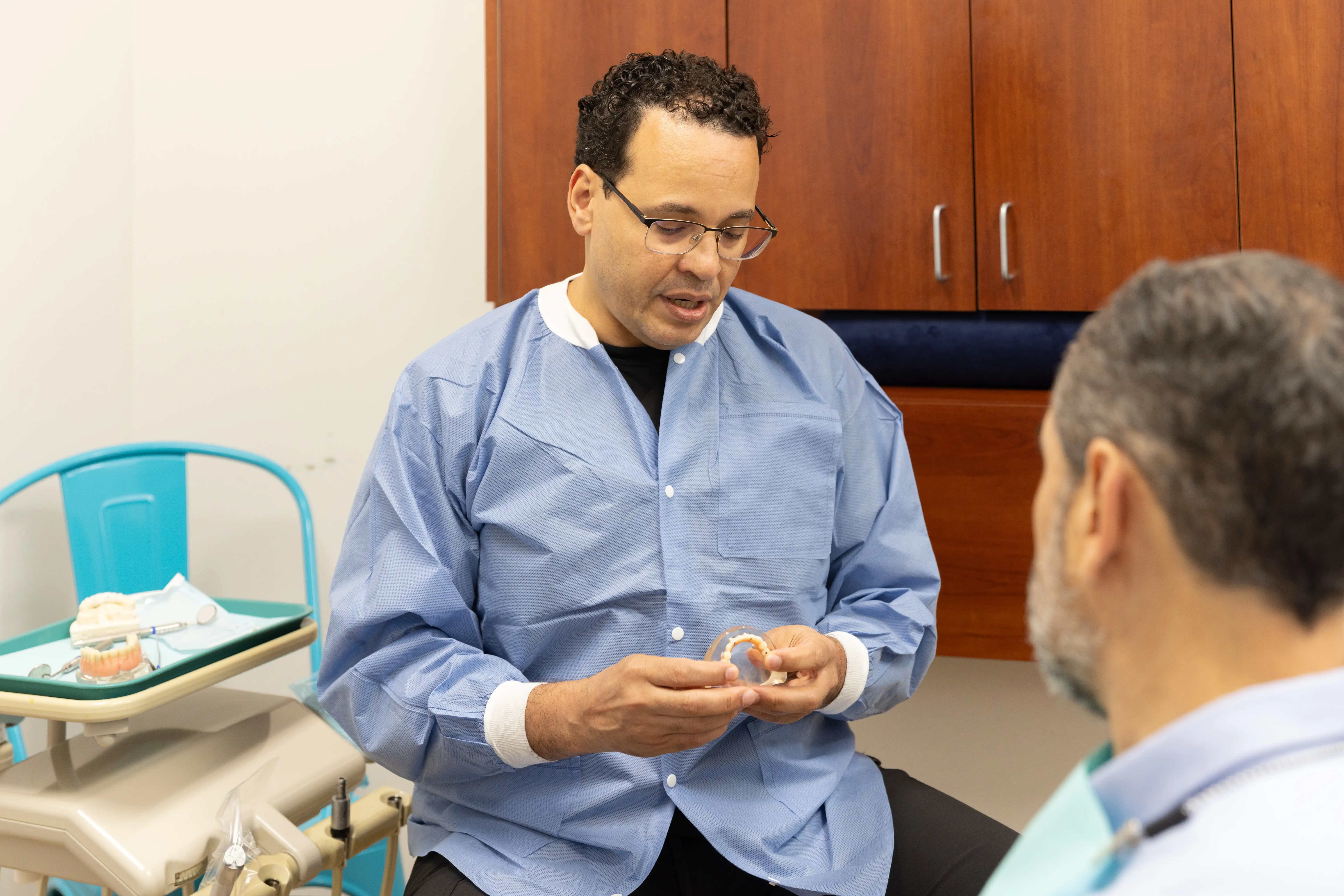 Dr. Rodriguez explaining dental bridges to a patient