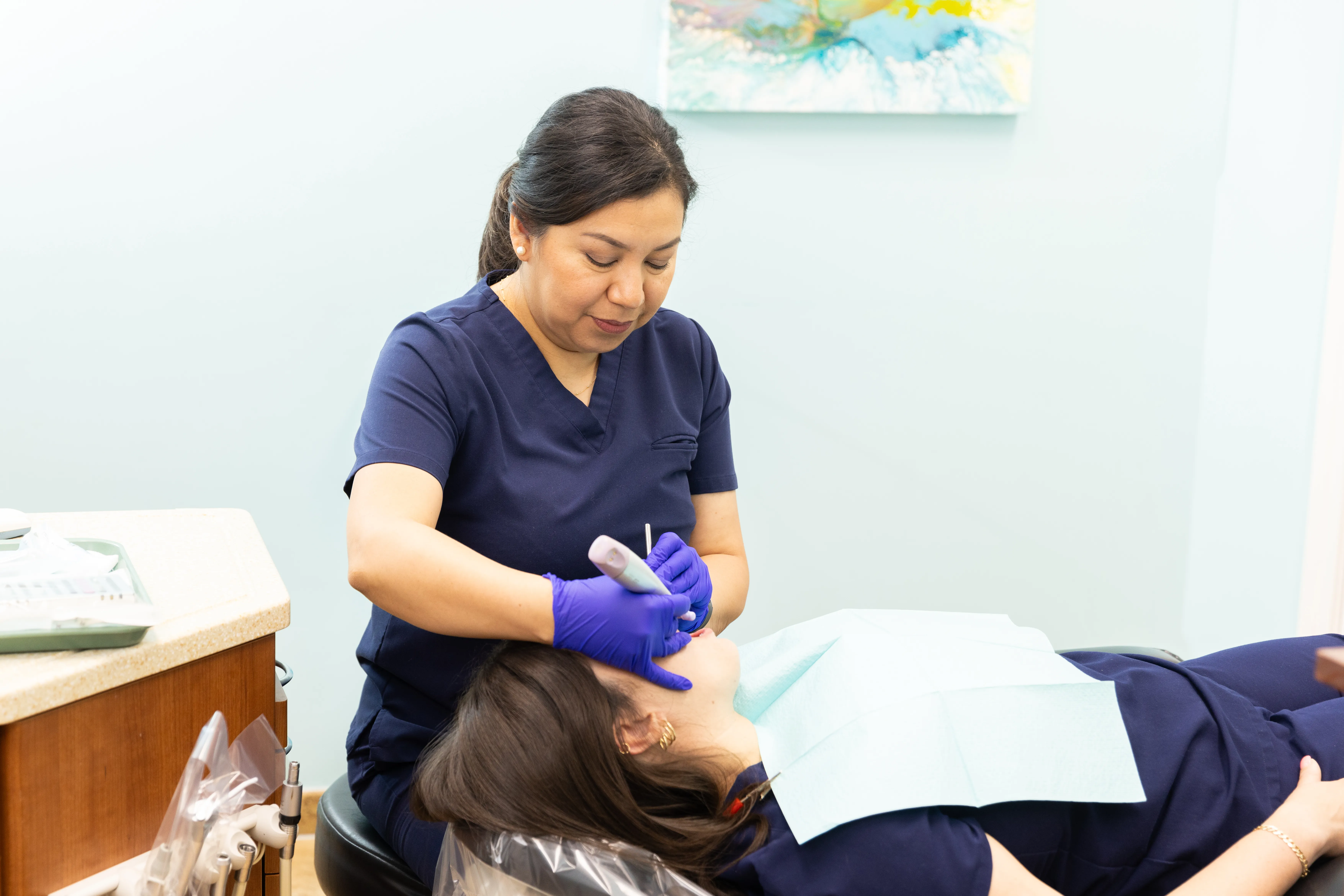 Hygienist preparing a patient for a root canal