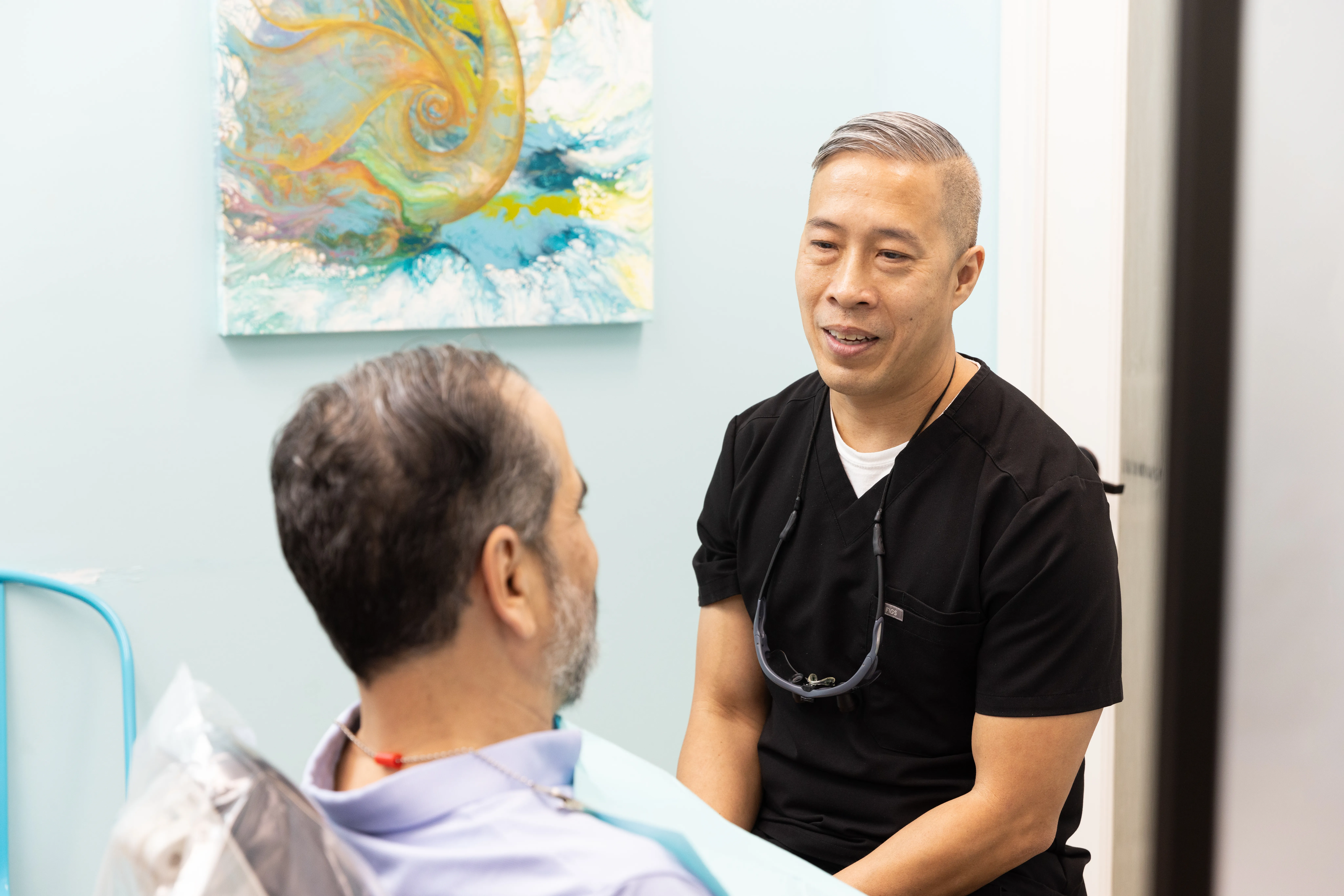 Dr. Nguyen explaining professional teeth whitening